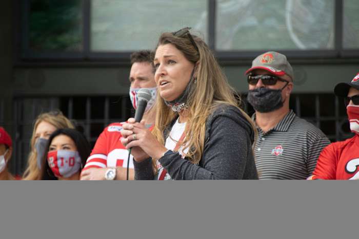 Amanda Babb addresses a crowd of more than 100 Ohio State football fans